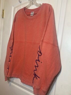 PINK by Victoria Secret Coral colored  Graphic Sleeve crewneck sweatshirt.
